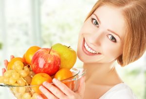 happy girl and healthy vegetarian food, fruit